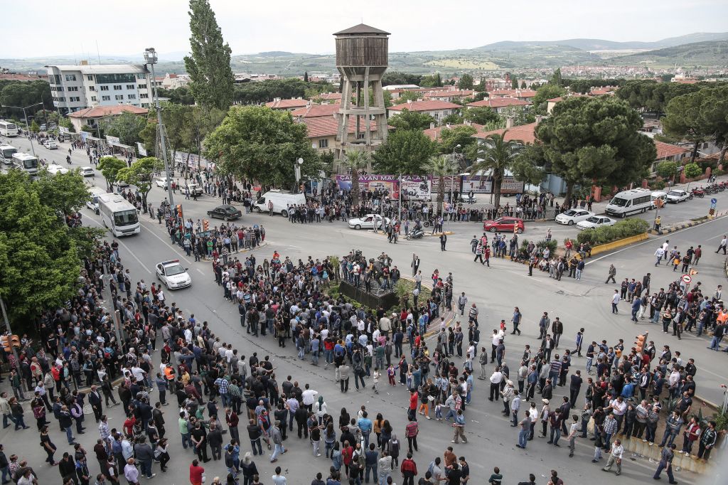 People take to the street and march to the local office of Prime Minister Erdogan's Justice and Development Party in Soma, Turkey, on Wednesday (photo credit: AP/Emrah Gurel) People take to the street and march to the local office of Prime Minister Erdogan's Justice and Development Party in Soma, Turkey, on Wednesday (photo credit: AP/Emrah Gurel)