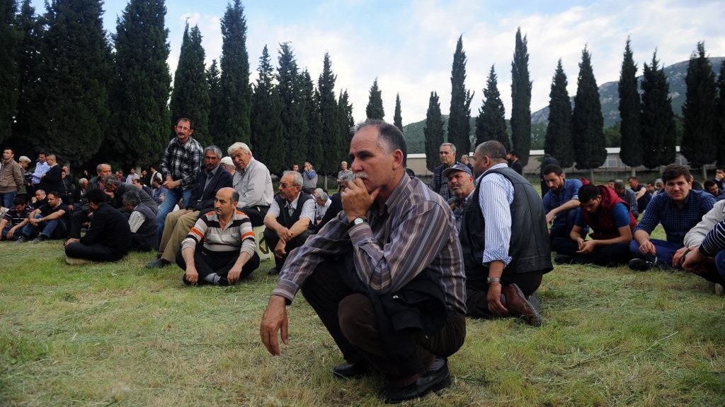 Turkey Mining Acciden_Horo People attend a mine accident victim's burial in Soma, Turkey, on Wednesday photo credit: AP/Emre Tazegul)