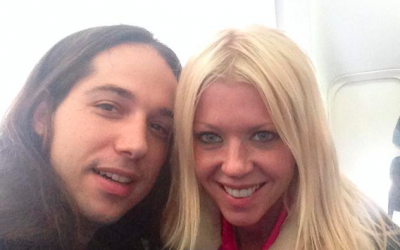 Infected Mushroom musician Erez Eisen and his girlfriend, Tara Reid, on the plane to Israel (Courtesy Infected Mushroom Facebook page)