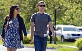 In this July 9, 2011, file photo, Mark Zuckerberg, president and CEO of Facebook, walks to morning sessions with his then girlfriend Priscilla Chan during the 2011 Allen and Co. Sun Valley Conference, in Sun Valley, Idaho. (Photo credit: AP/Julie Jacobson)
