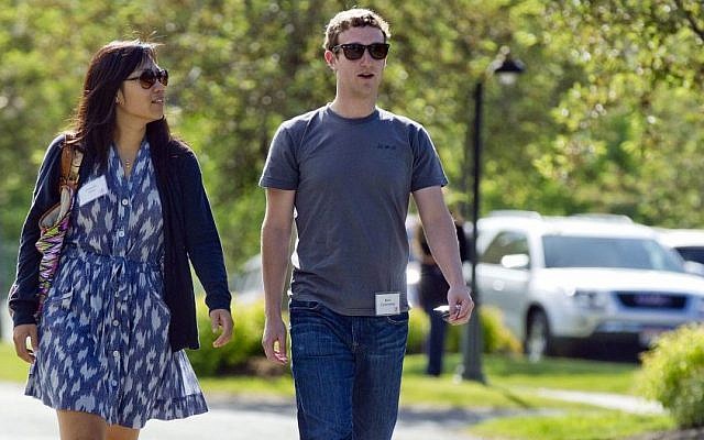 In this July 9, 2011, file photo, Mark Zuckerberg, president and CEO of Facebook, walks to morning sessions with his then girlfriend Priscilla Chan during the 2011 Allen and Co. Sun Valley Conference, in Sun Valley, Idaho. (Photo credit: AP/Julie Jacobson) In this July 9, 2011, file photo, Mark Zuckerberg, president and CEO of Facebook, walks to morning sessions with his then girlfriend Priscilla Chan during the 2011 Allen and Co. Sun Valley Conference, in Sun Valley, Idaho. (Photo credit: AP/Julie Jacobson)