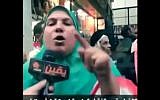 Muna al-Beheiri tells US President Barack Obama to shut his 'mouse' on live television, February 2014. (screen capture, YouTube)