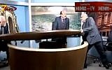 Two Jordanian journalists tear up a TV studio during an argument over Syria's civil war (Photo credit: Youtube screen capture)