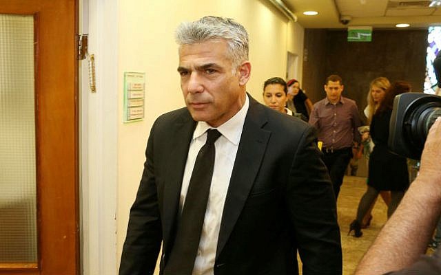 Finance Minister Yair Lapid arrives at the Prime Minister's Office in Jerusalem, April 27, 2014 (photo credit: Amit Shabi/POOL/Flash90) Finance Minister Yair Lapid arrives at the Prime Minister's Office in Jerusalem, April 27, 2014 (photo credit: Amit Shabi/POOL/Flash90)