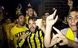 Fans celebrating Maccabi Tel Aviv's win in Tel Aviv Sunday night, May 18, 2014. (photo credit: Flash90)