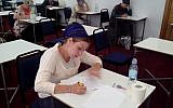 Illustrative: Miriam Goldfisher, director of a kosher supervision class for women, studying Jewish dietary laws in preparation for the Israeli Chief Rabbinate exam on the topic. (JTA)