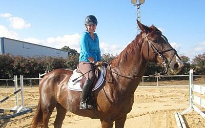 Equestrian show jumper and Olympic hopeful Danielle Goldstein practicing her routine in central Israel, May 12, 2014 (photo credit: Ben Sales/JTA)