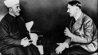 A picture from a 1941 meeting between Adolf Hitler and the Palestinian Mufti Haj Amin al-Husseini that featured in a 2014 campaign in Washington DC (photo credit: public domain) A picture from a 1941 meeting between Adolf Hitler and the Palestinian Mufti Haj Amin al-Husseini that featured in a 2014 campaign in Washington DC (photo credit: public domain)