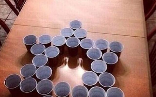 Screenshot from a report on Fox4 in Florida displaying a picture of the Jews vs Nazis beer pong drinking game tweeted by high school kids.