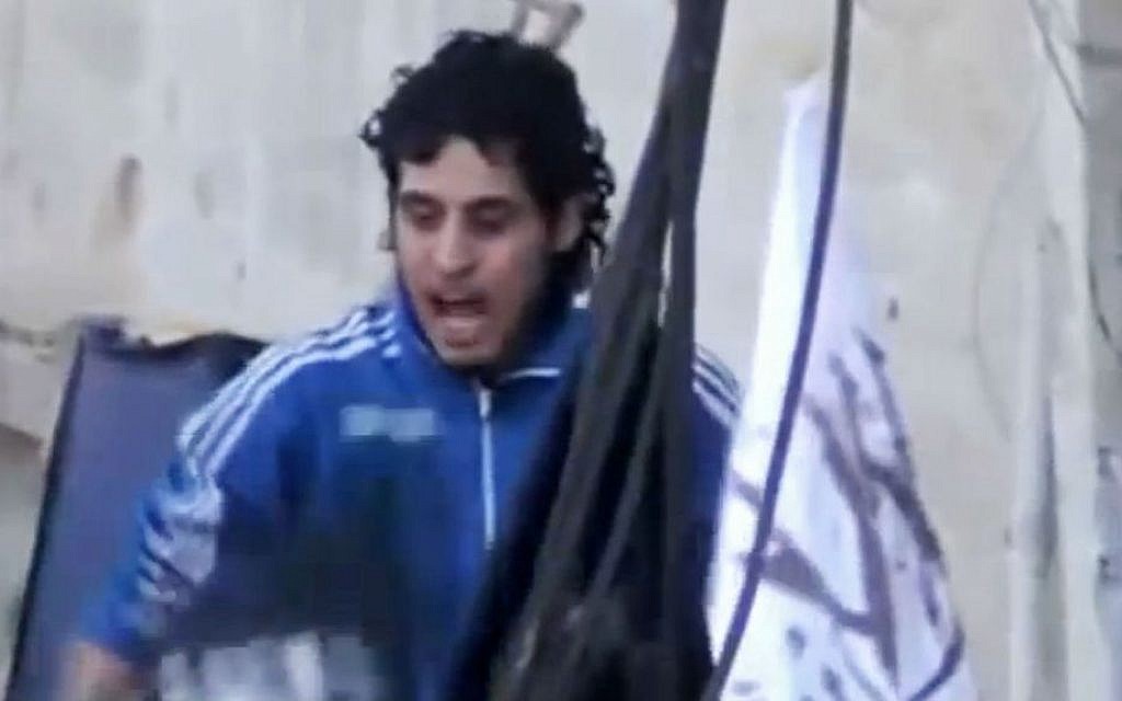 Amateur video image showing revolutionary goalkeeper Abdelbasit Sarout chanting slogans during a demonstration in Homs, Syria,Feb. 13, 2014.
(AP/Shaam News Network via AP video) Amateur video image showing revolutionary goalkeeper Abdelbasit Sarout chanting slogans during a demonstration in Homs, Syria,Feb. 13, 2014.
(AP/Shaam News Network via AP video)
