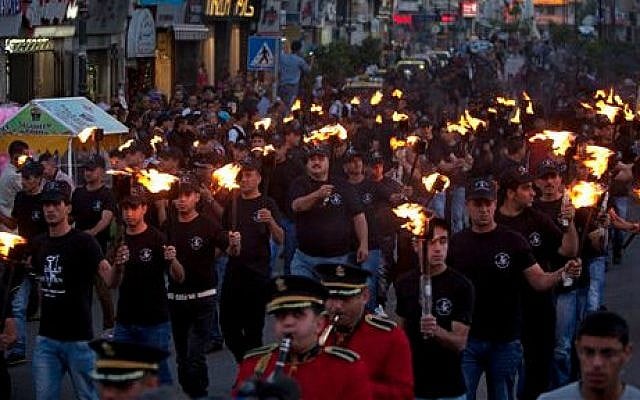 Palestinians hold torches marking the 66th anniversary of "Nakba," or “catastrophe” referring to their uprooting in the war over Israel's 1948 creation, in the West Bank city of Ramallah, Wednesday, May 14, 2014 (photo credit: AP/Majdi Mohammed) Palestinians hold torches marking the 66th anniversary of "Nakba," or “catastrophe” referring to their uprooting in the war over Israel's 1948 creation, in the West Bank city of Ramallah, Wednesday, May 14, 2014 (photo credit: AP/Majdi Mohammed)