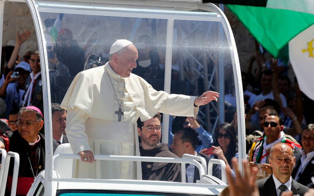 Pope Francis waving to the people after a mass in the Manger Square, next the Nativity Church, in the West Bank city of Bethlehem on May 25, 2014 (photo credit: Sliman Khader/Flash90)