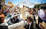 Pope Francis waving to the people after a mass in the Manger Square, next the Nativity Church, in the West Bank city of Bethlehem on May 25, 2014 (photo credit: Atta Jaber/Flash90)