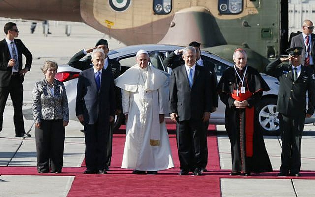 President Shimon Peres (3rd on the left) and Prime Minister Benjamin Netanyahu (3rd on the right ) stand with Pope Francis (center) on the red carpet after he landed at Ben Gurion international airport near Tel Aviv May 25, 2014 (photo credit: Miriam Alster/Flash90)