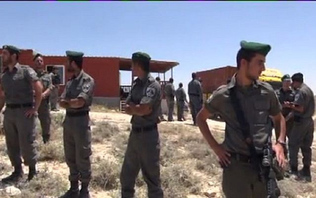 Border Police outside a home slated for destruction in Ma'ale Rehavam Wednesday. (Screen capture: Israel National News) Border Police outside a home slated for destruction in Ma'ale Rehavam Wednesday. (Screen capture: Israel National News)