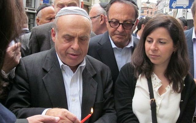 Jewish Agency chairman Natan Sharansky lights a memorial candle at the Jewish Museum of Belgium in Brussels, in memory of the victims of an attack on May 2, which left four dead (photo credit: courtesy of the Jewish Agency) Jewish Agency chairman Natan Sharansky lights a memorial candle at the Jewish Museum of Belgium in Brussels, in memory of the victims of an attack on May 2, which left four dead (photo credit: courtesy of the Jewish Agency)