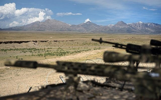 A general view of rifles on a range at a Forward Operating Base in Afghanistan on May 28, 2014 (photo credit: AFP/Brendan Smialowski) A general view of rifles on a range at a Forward Operating Base in Afghanistan on May 28, 2014 (photo credit: AFP/Brendan Smialowski)