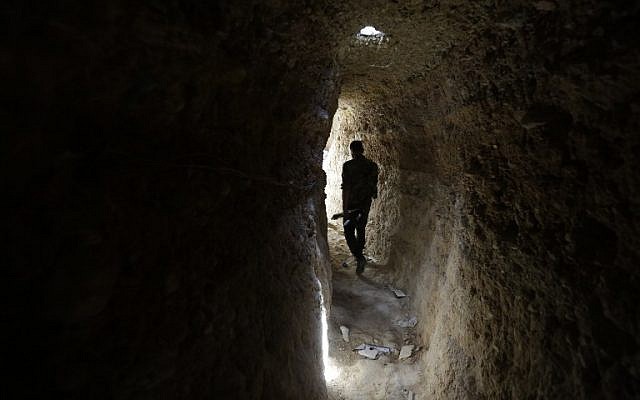 A Syrian army soldier makes his way in a tunnel reportedly previously used by rebel fighters in Jobar, a mostly rebel-held area on the eastern outskirts of Damascus on June 2, 2014. (photo credit: AFP/JOSEPH EID) A Syrian army soldier makes his way in a tunnel reportedly previously used by rebel fighters in Jobar, a mostly rebel-held area on the eastern outskirts of Damascus on June 2, 2014. (photo credit: AFP/JOSEPH EID)