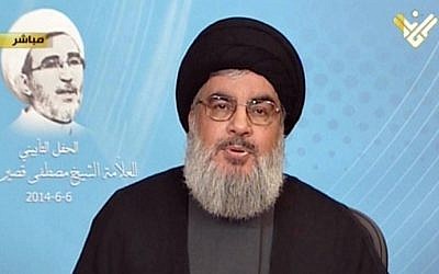 Hezbollah's al-Manar TV shows Hezbollah chief Hassan Nasrallah giving a televised address from an undisclosed location on June 6, 2014 (Photo credit: Al-Manar/AFP)