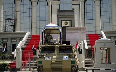 Egyptian troops stand guard outside the high constitutional court in the capital Cairo on June 7, 2014 one day before the swearing in ceremony of president elected and ex-army chief Abdel Fattah al-Sissi. (photo credit: Khaled Desouki/AFP)