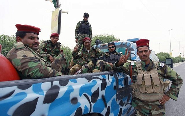 Iraqi soldiers gather as their unit is shipped north to Mosul following increased violence, on June 8, 2014 (photo credit: AFP/Haidar Hamdani) Iraqi soldiers gather as their unit is shipped north to Mosul following increased violence, on June 8, 2014 (photo credit: AFP/Haidar Hamdani)