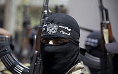 Masked Palestinian militants in Beit Lahia, northern Gaza Strip, June 12, 2014 (photo credit: AFP/MOHAMMED ABED)