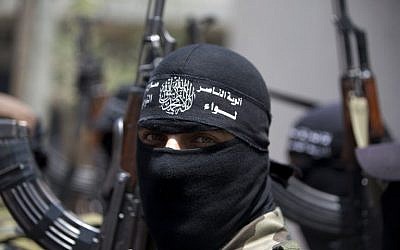Masked Palestinian militants in Beit Lahia, northern Gaza Strip, June 12, 2014 (photo credit: AFP/MOHAMMED ABED)