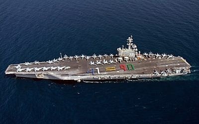 A handout picture released by the US Navy shows aircraft carrier USS George H.W. Bush (CVN 77) sailing in the Arabian Sea on June 13, 2014. (photo credit: AFP PHOTO / HO / US NAVY)