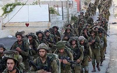 IDF soldiers in Hebron on June 17, 2014. (photo credit: AFP Photo/Hazem Bader)