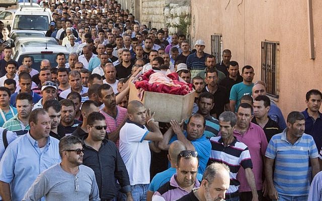 Relatives of Arab Israeli youth Mohammed Karkara,15, carry his coffin during his funeral in the northern Israeli village of Arrabe on June 23, 2014. (AFP/JACK GUEZ) Relatives of Arab Israeli youth Mohammed Karkara,15, carry his coffin during his funeral in the northern Israeli village of Arrabe on June 23, 2014. (AFP/JACK GUEZ)