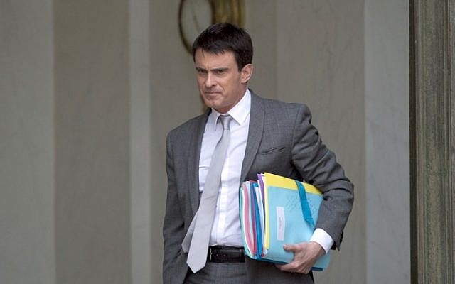 French Prime Minister Manuel Valls leaves the Elysee palace in Paris on June 3, 2014, after the weekly cabinet meeting. (photo credit: AFP Photo/Alain Jocard) 