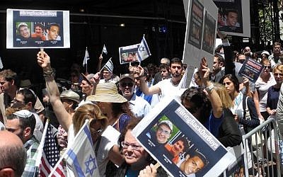 Protesters rally in support of three kidnapped Israeli teenagers during a demonstration in front of the Israeli consulate in New York on June 16, 2014. (photo credit: AFP/ Brigitte Dusseau)
