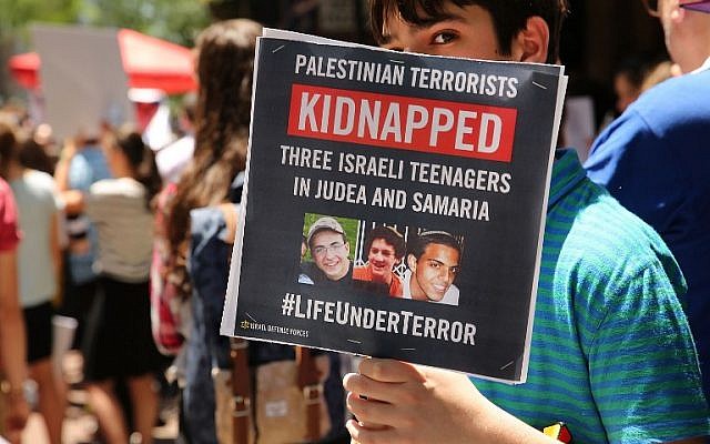 People gather for a vigil for the three missing Israeli teens outside of the Israeli Consulate on June 16, 2014 in New York City. (photo credit: Spencer Platt/Getty Images/AFP) People gather for a vigil for the three missing Israeli teens outside of the Israeli Consulate on June 16, 2014 in New York City. (photo credit: Spencer Platt/Getty Images/AFP)