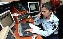 A policewoman working in the emergency call center.  The individual in this photo has no connection to the story (illustrative photo: Flash90)