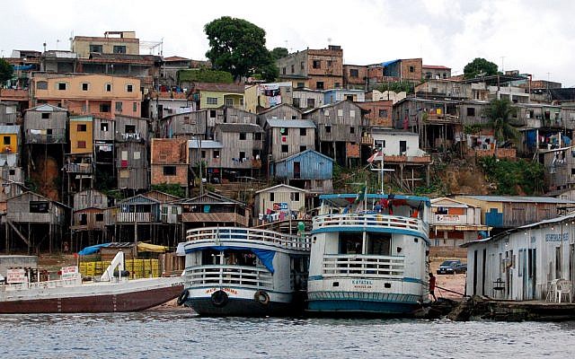 A waterfront favela in Manaus. (photo credit: CC BY, Zemlinko!, Flickr)