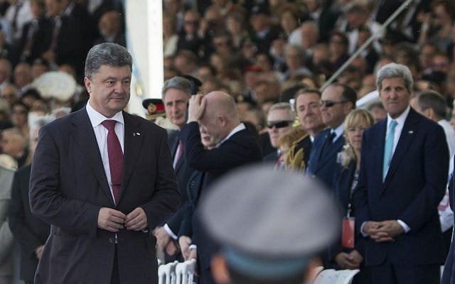 Ukraine's President-elect Petro Poroshenko left, walks past US Secretary of State John Kerry, right, at the commemoration of the 70th anniversary of the D-Day in Ouistreham, western France, Friday, June 6, 2014. (Photo credit: AP Photo/Alexander Zemlianichenko) Ukraine's President-elect Petro Poroshenko left, walks past US Secretary of State John Kerry, right, at the commemoration of the 70th anniversary of the D-Day in Ouistreham, western France, Friday, June 6, 2014. (Photo credit: AP Photo/Alexander Zemlianichenko)