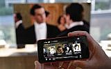 TV by phone (AP Photo/Ted S. Warren)
