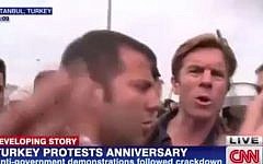 CNN International reporter Ivan Watson being detained by Turkish police live on-air, in Taksim Square, Istanbul, on May 31, 2014. (photo credit: screen capture YouTube)