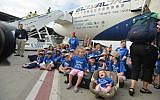 Illustrative: North American Jewish immigrants to Israel arrive in a special flight on behalf of the Jewish Agency and the Nefesh B'Nefesh organization, at Ben Gurion airport in central Israel, on July 23, 2013. (Yossi Zeliger/Flash90)
