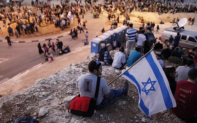 Israeli settlers hold a protest in the West Bank. File photo (Photo credit: Yonatan Sindel/Flash 90) Israeli settlers hold a protest in the West Bank. File photo (Photo credit: Yonatan Sindel/Flash 90)