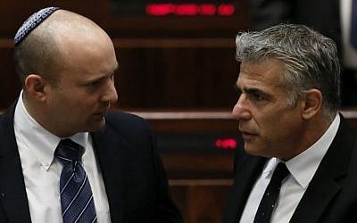 Economy Minister Naftali Bennett (L) with Finance Minister Yair Lapid in the Knesset, March 11, 2014. (photo credit: Miriam Alster/FLASH90) Economy Minister Naftali Bennett (L) with Finance Minister Yair Lapid in the Knesset, March 11, 2014. (photo credit: Miriam Alster/FLASH90)