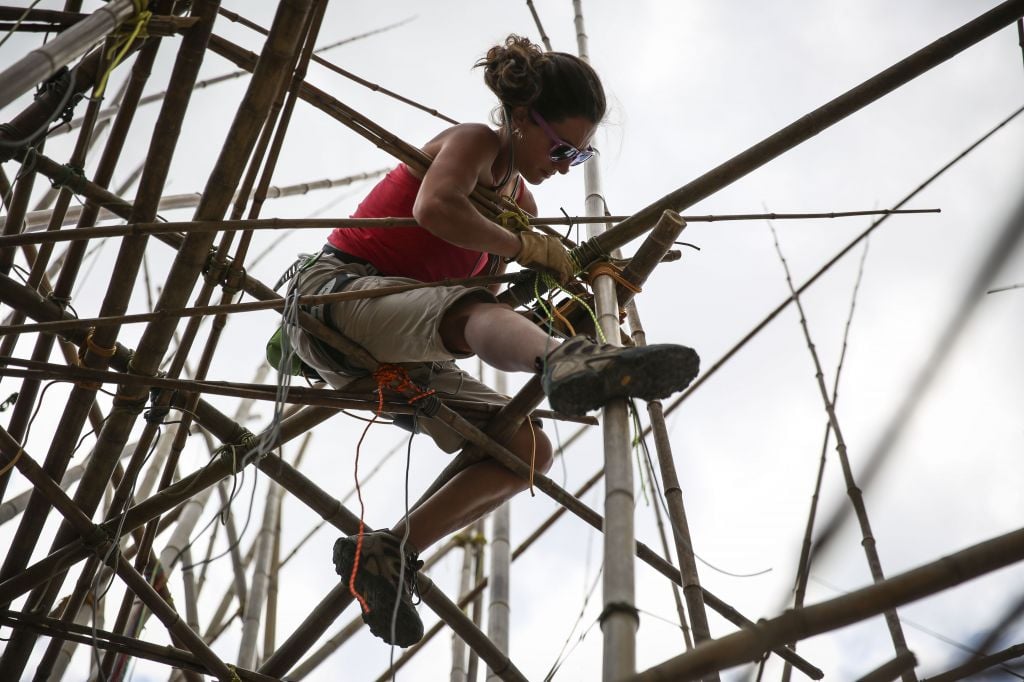 The Starn brothers brought in experienced rock climbers to help build the bamboo structure (photo credit: Hadas Parush/Flash 90)