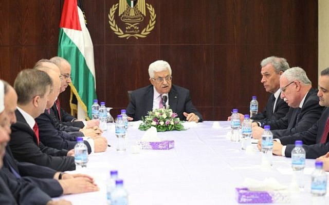 Palestinian Authority President Mahmoud Abbas meets with his new unity government in the West Bank city of Ramallah, June 2, 2014 (photo credit: Issam Rimawi/Flash90) Palestinian Authority President Mahmoud Abbas meets with his new unity government in the West Bank city of Ramallah, June 2, 2014 (photo credit: Issam Rimawi/Flash90)