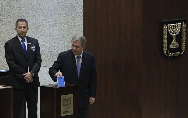 President candidate Meir Sheetrit casts his vote in the elections for the next Israeli president, in the Knesset, Tuesday, June 10, 2014 (photo credit: Miriam Alster/Flash90)
