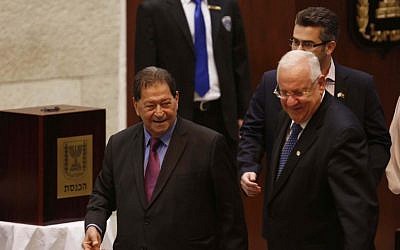 Presidential candidate Reuven Rivlin walks past the ballot box with former candidate Binyamin Ben-Eliezer, during Israel's presidential vote in the Knesset, June 10, 2014. (Yonatan Sindel/Flash90)