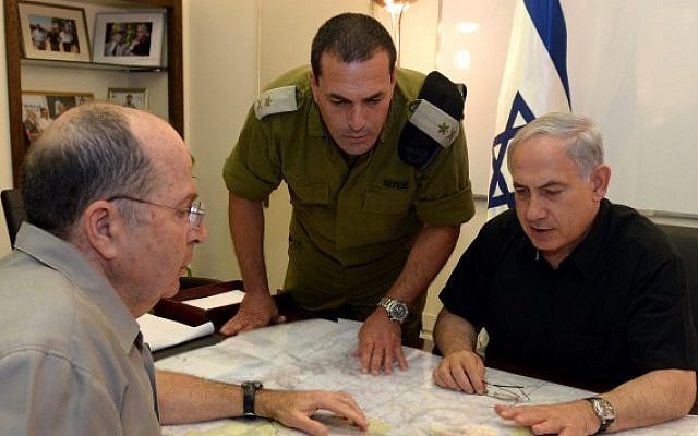 Prime Minister Benjamin Netanyahu and Defense Minister Moshe (Bogie) Ya'alon meet on June 13, 2014, as security forces search for three missing yeshiva students, feared kidnapped in the West Bank. (photo credit: Haim Zach/GPO/Flash90) Prime Minister Benjamin Netanyahu and Defense Minister Moshe (Bogie) Ya'alon meet on June 13, 2014, as security forces search for three missing yeshiva students, feared kidnapped in the West Bank. (photo credit: Haim Zach/GPO/Flash90)
