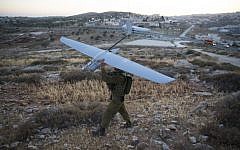 An Israeli soldier holds a Skylark drone during the search for three Jewish teenagers near Hebron, in the West Bank, June 14, 2014. (Yonatan Sindel/Flash90)