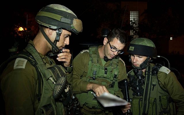 Soldiers from the IDF Kfir Brigade in the Jilazoun refugee camp, near the West Bank city of Hebron, during search efforts for three kidnapped Israeli teenagers, on June 16, 2014. (photo credit: IDF Spokesperson/Flash90) Soldiers from the IDF Kfir Brigade in the Jilazoun refugee camp, near the West Bank city of Hebron, during search efforts for three kidnapped Israeli teenagers, on June 16, 2014. (photo credit: IDF Spokesperson/Flash90)