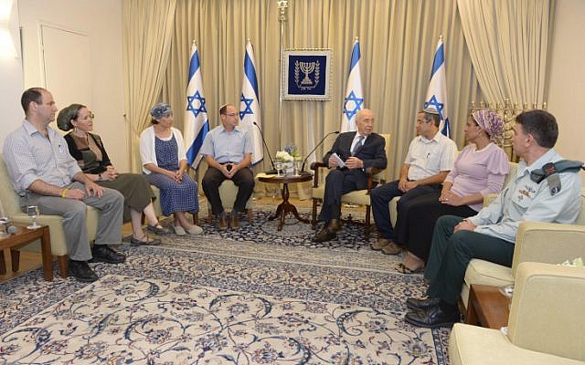 President Shimon Peres meets with families of kidnapped Jewish teenagers at the president's residence in Jerusalem on June 19, 2014. (photo credit: Mark Neyman/GPO/Flash90)