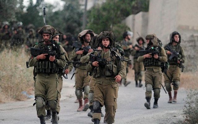 Israeli soldiers patrol near Ramallah on Friday, June 20, 2014 (Photo credit: Issam Rimawi/Flash 90) Israeli soldiers patrol near Ramallah on Friday, June 20, 2014 (Photo credit: Issam Rimawi/Flash 90)